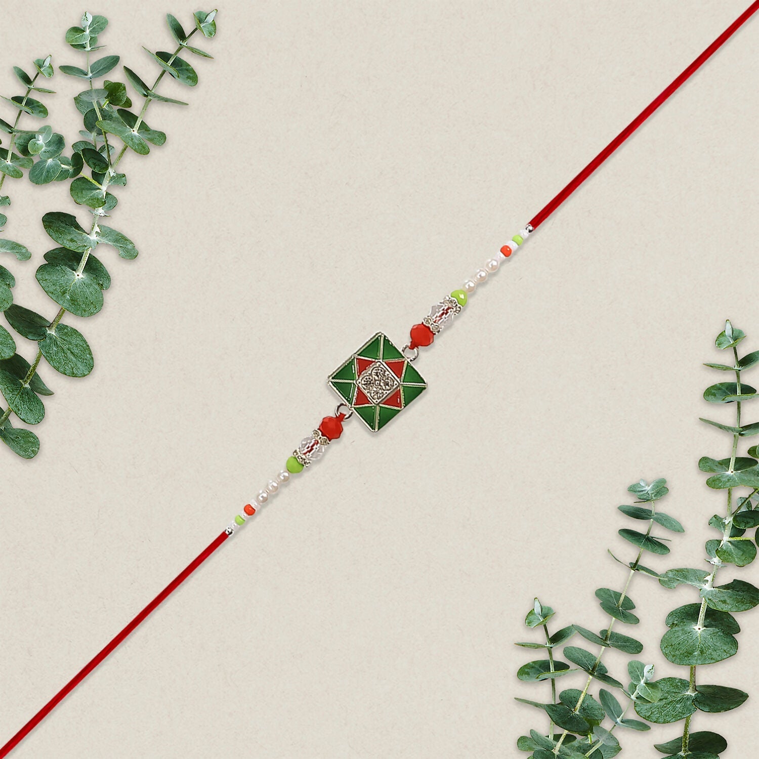 Combo Pack of 12 Green Square Designer Rakhis with Red Accents and Pearl Beaded Threads – Festive Gift Edition